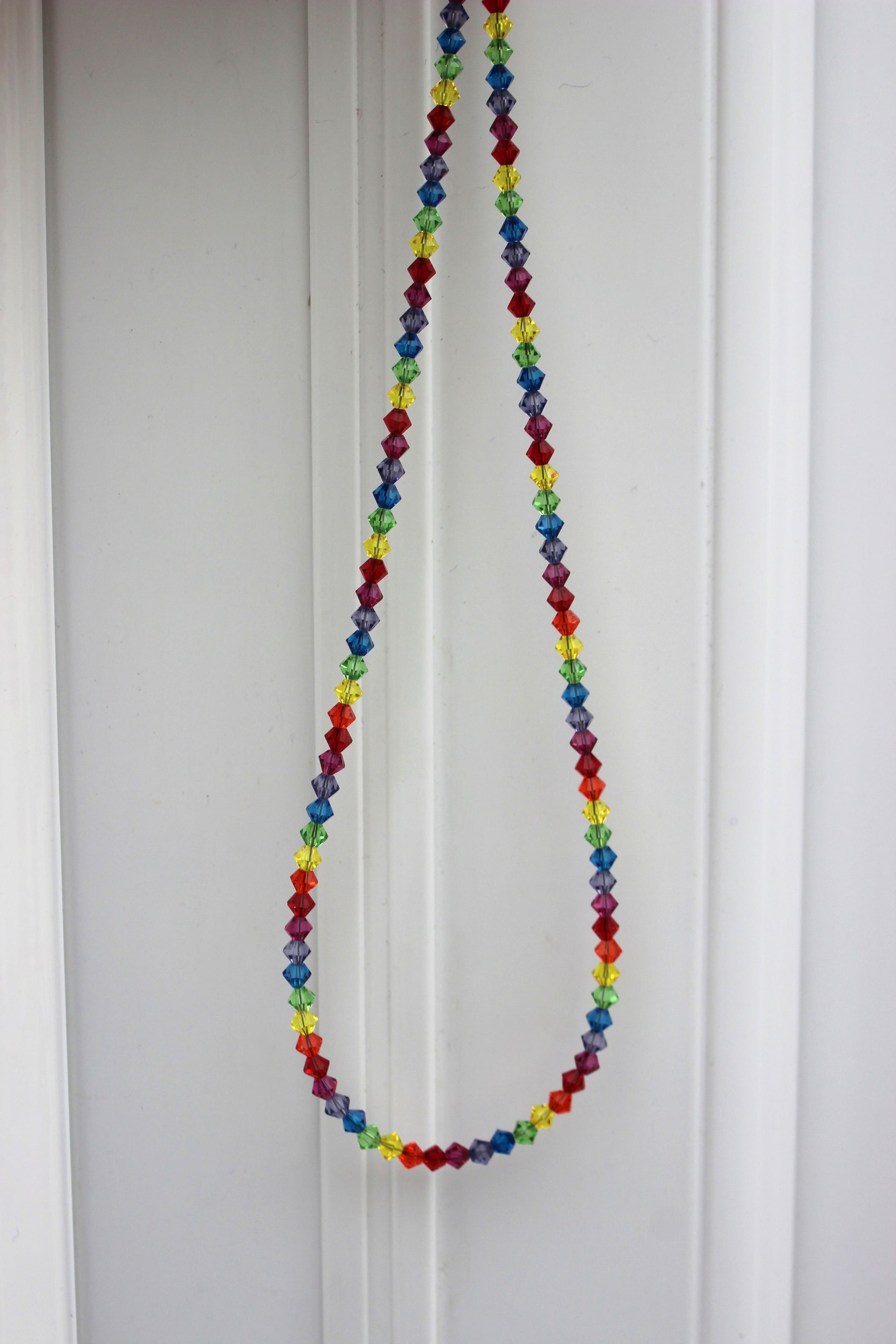 Colorful beaded necklace on a white background
