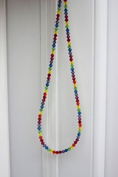 Colorful beaded necklace on a white background