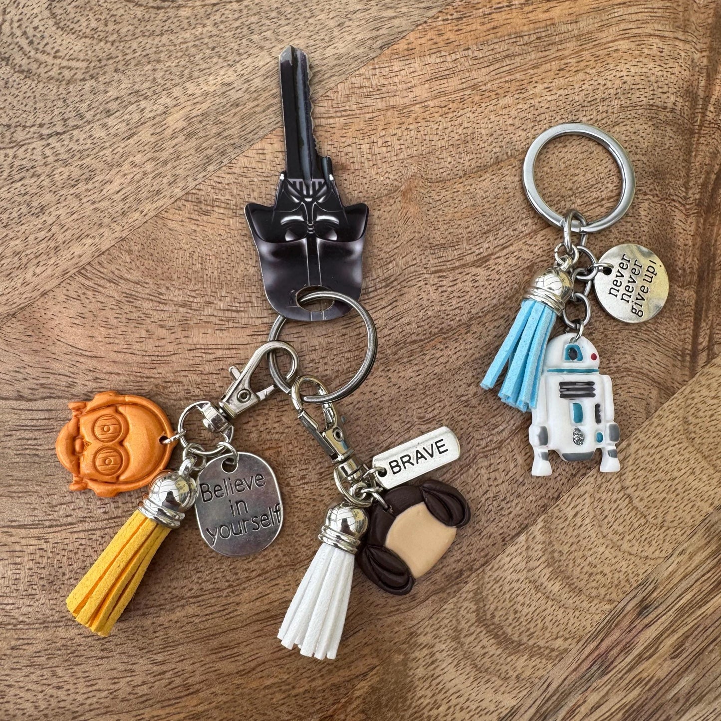 Keychain with various charms on a wooden surface