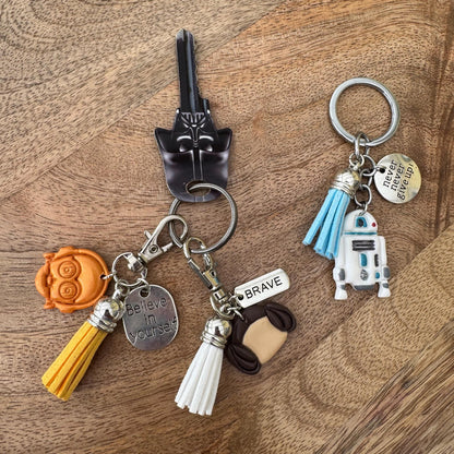 Keychain with various charms on a wooden surface