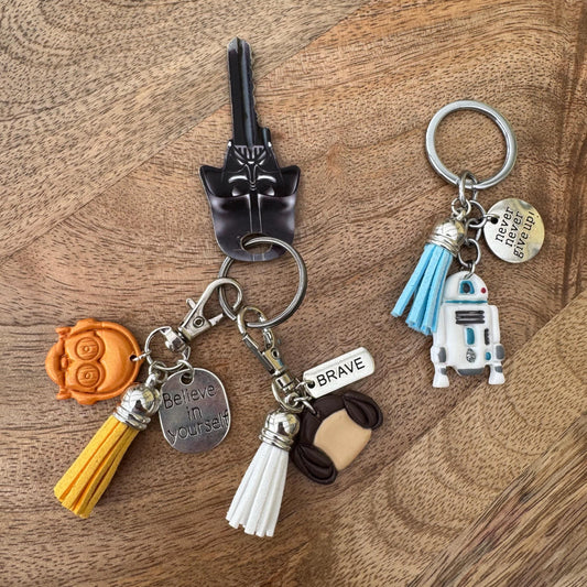 Keychain with various charms on a wooden surface